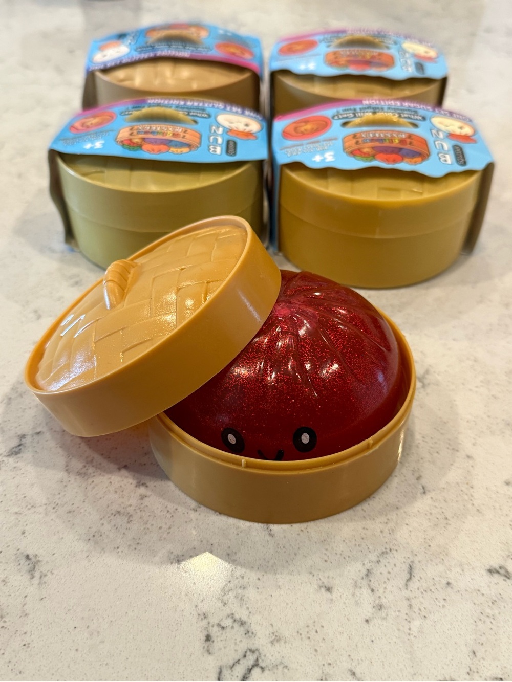 Kawaii Red Glitter Bun Squishy in Yellow Container
